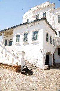 Cape Coast Castle. The archway leads to the male dungeons. The stairs lead to the castle church.